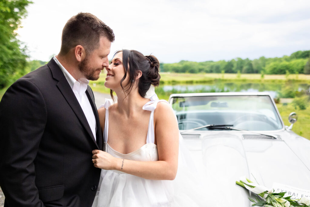 Candid moments of a bride and groom by their classic car just after their wedding ceremony.  Some of their first moments as husband and wife.
